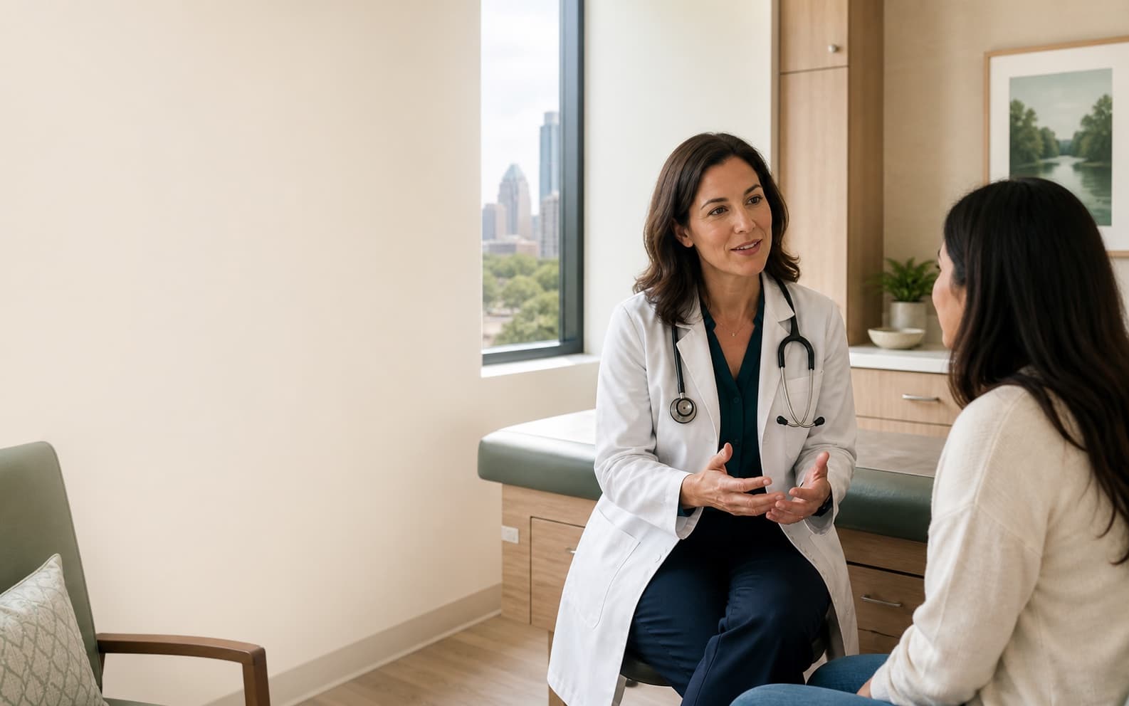 A physician having a thoughtful consultation with a patient in a bright clinic