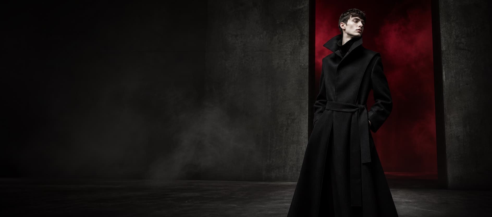 Model wearing an architectural black coat in the NØIR FORM campaign